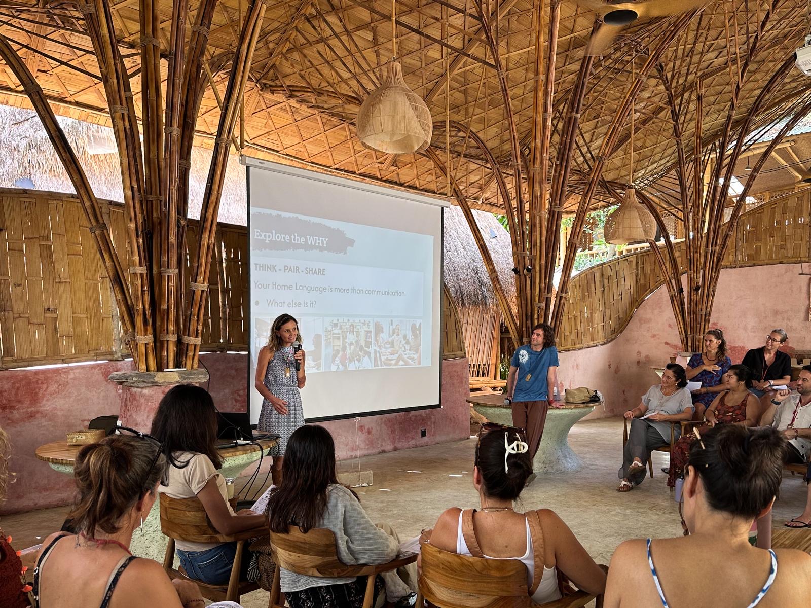 Audience watching presentation in bamboo pavilion