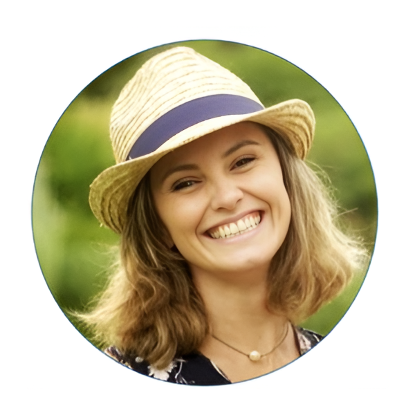 Smiling woman wearing straw hat outdoors