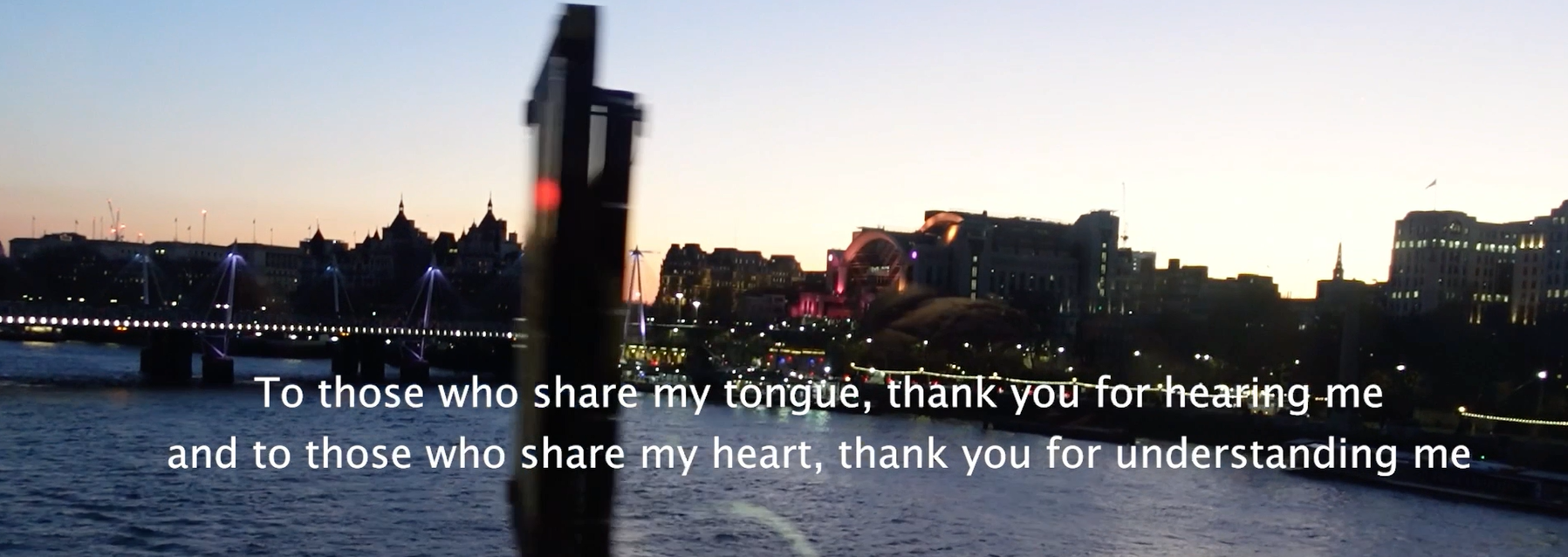 Evening riverside skyline with overlaid text